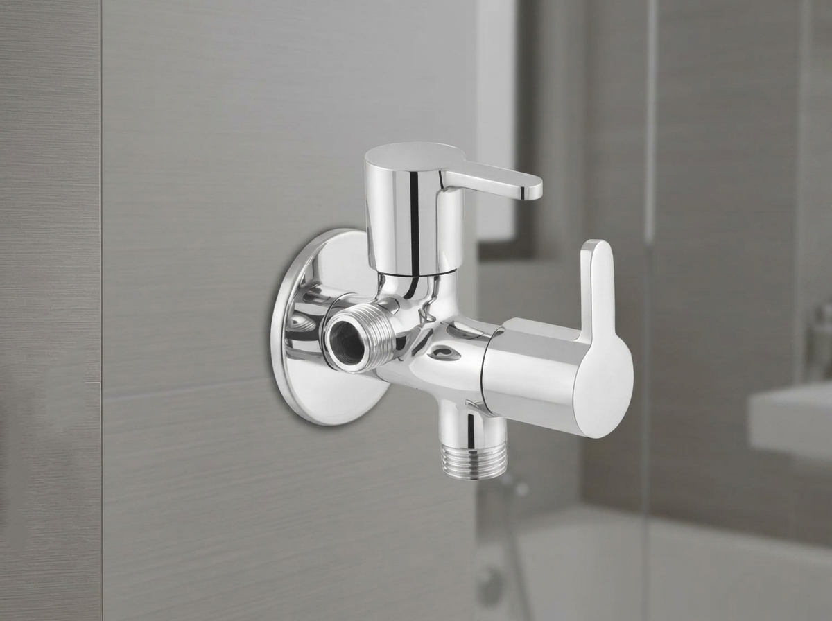 Chrome dual control angle valve mounted on a tiled wall