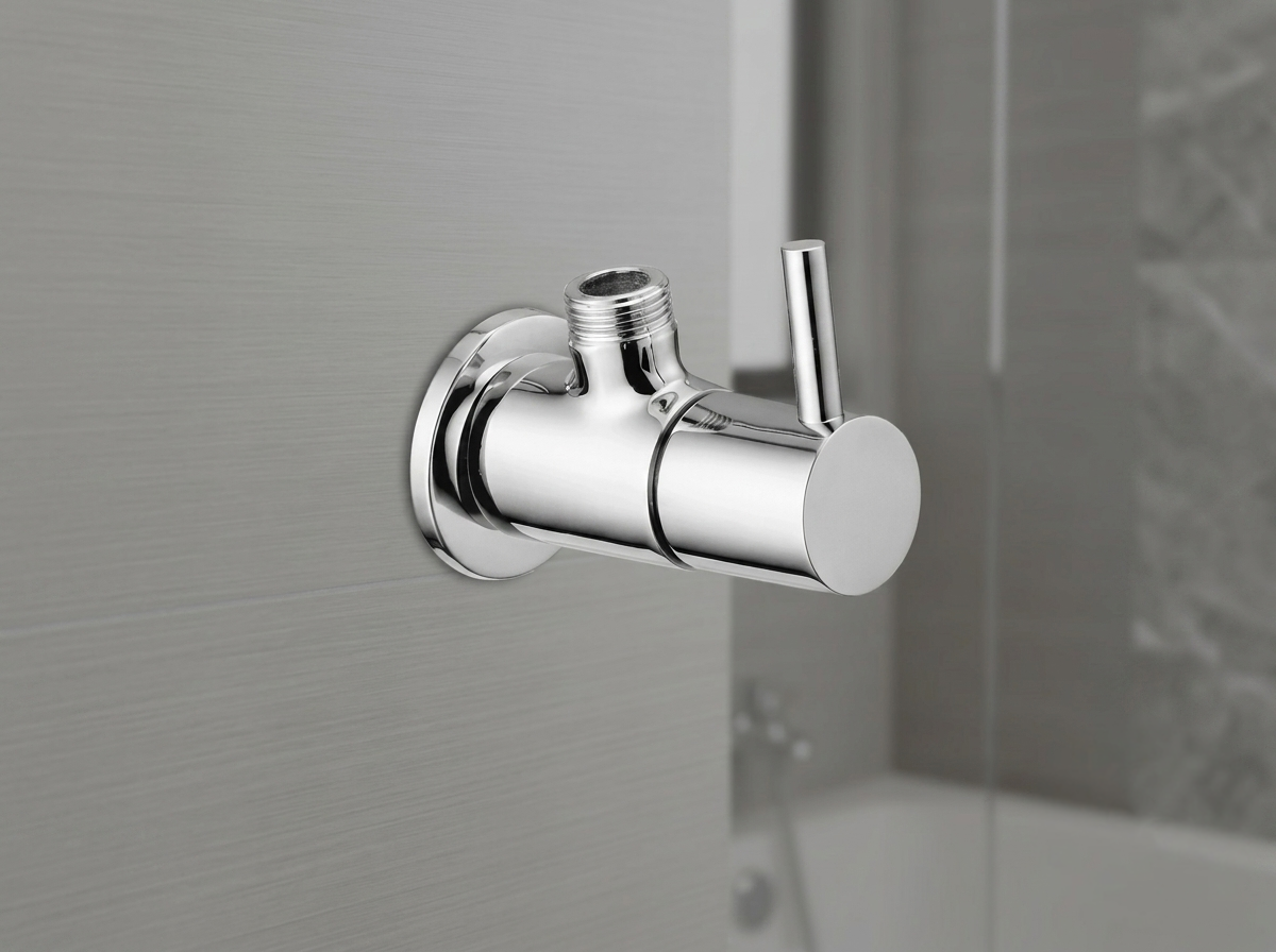 Chrome angle valve with lever handle mounted on a wall