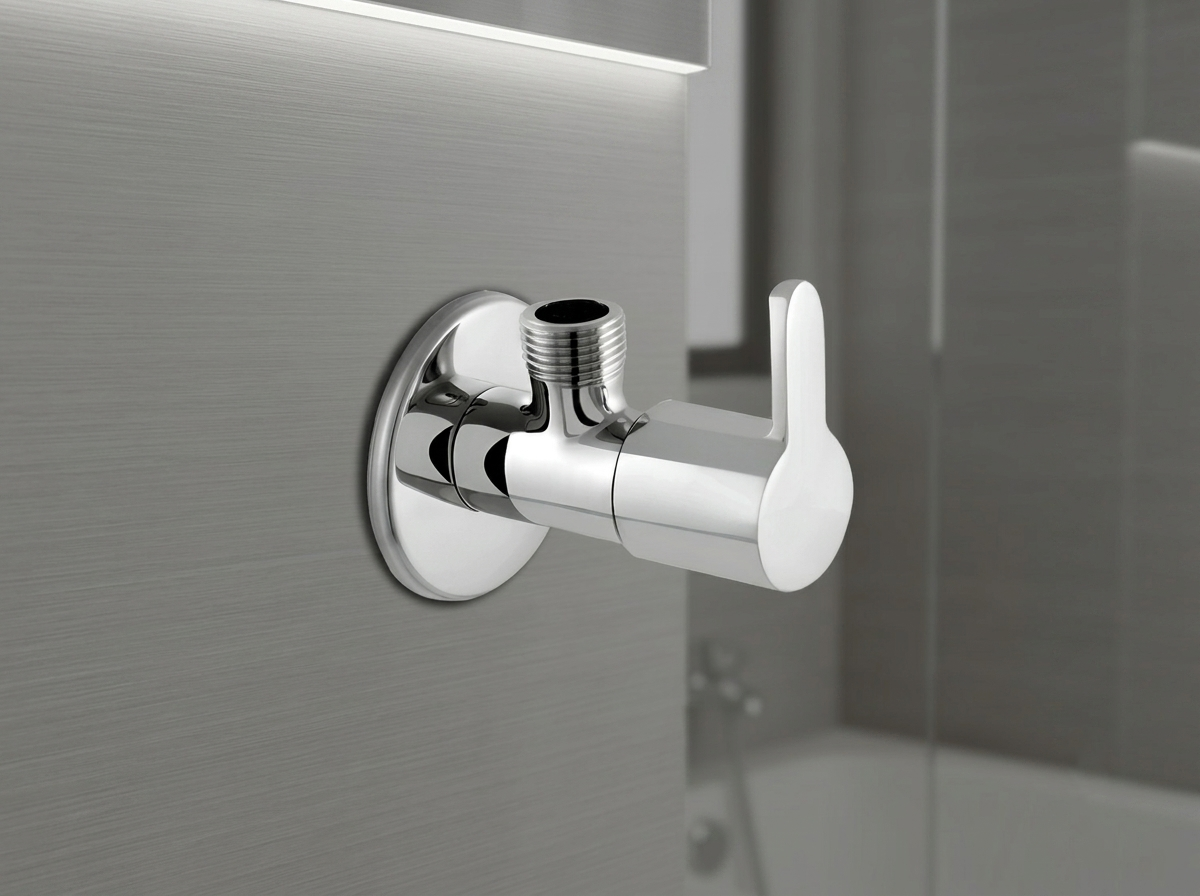 Chrome angle valve with lever handle mounted on a grey wall